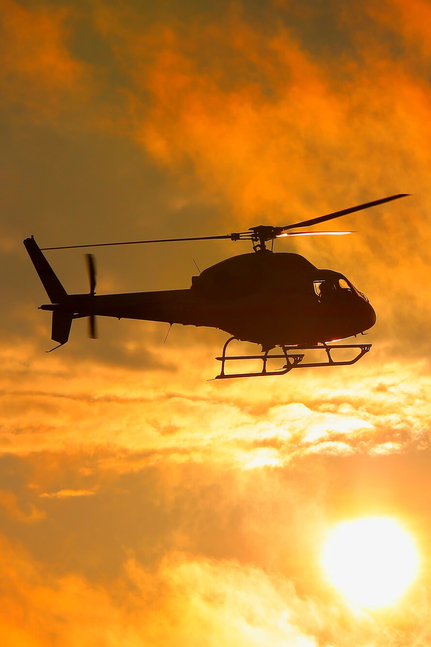 Helicopter at sunset